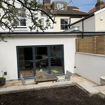 patio doors to the garden with chairs