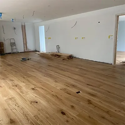 a room that is being remodelled with wood flooring